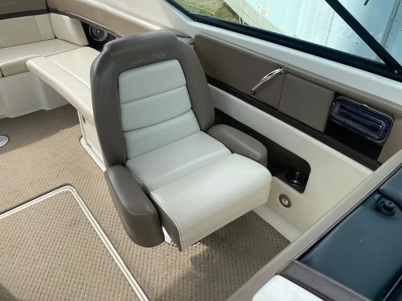 Slide: The Image of 2013 Sea Ray 270 SLX boat cockpit with steering wheel and control panel. - 9