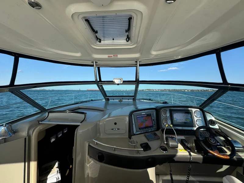Slide: The Image of Interior view of 2007 Sea Ray 440 Sundancer yacht cockpit with navigation equipment. - 11