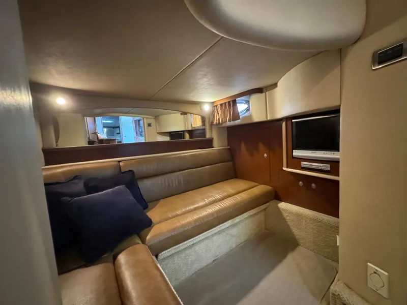 Slide: The Image of Interior of 2007 Sea Ray 440 Sundancer with leather seating and TV. - 18