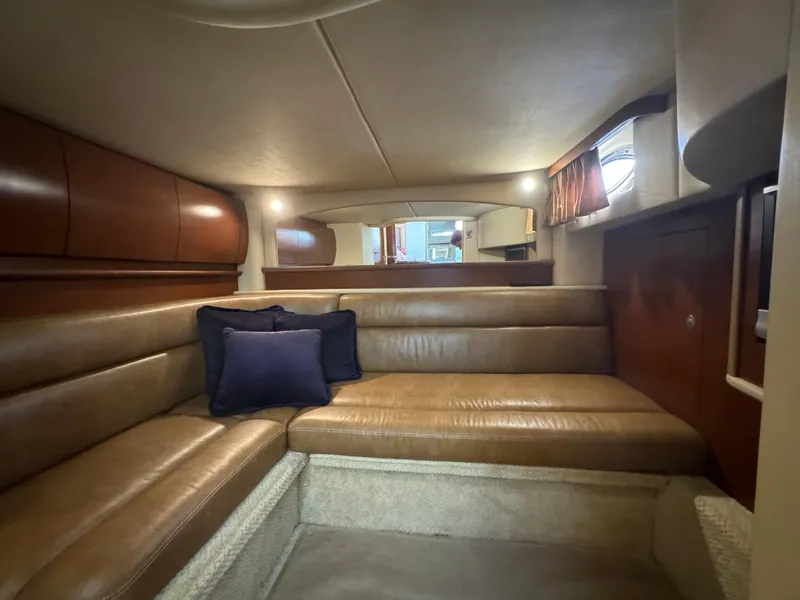 Slide: The Image of Luxurious interior of 2007 Sea Ray 440 Sundancer with leather seating and elegant wood finishes. - 19