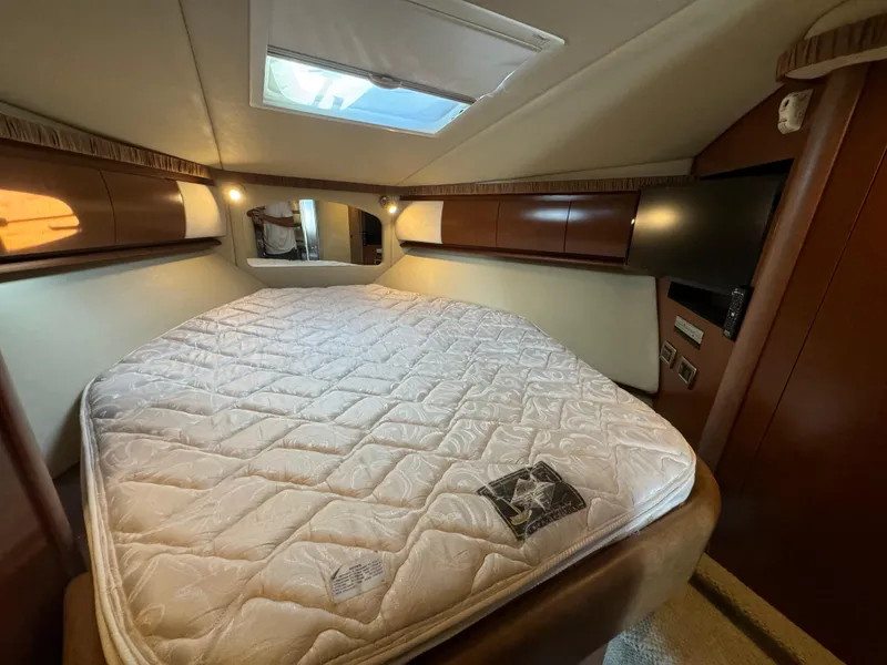Slide: The Image of Luxurious cabin interior of 2007 Sea Ray 440 Sundancer yacht with skylight and cozy bed. - 21