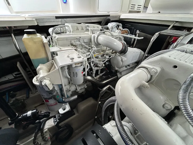 Slide: The Image of Engine room of 2007 Sea Ray 440 Sundancer yacht, showcasing detailed machinery. - 25