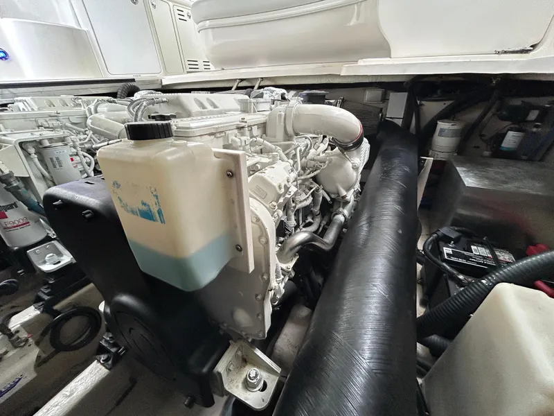 Slide: The Image of Engine compartment of 2007 Sea Ray 440 Sundancer boat, showcasing detailed machinery. - 26