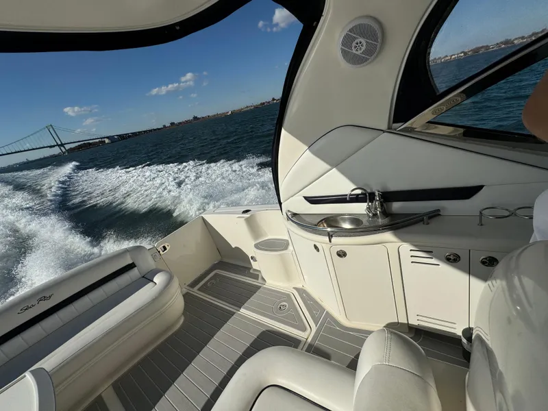 Slide: The Image of Interior of 2007 Sea Ray 440 Sundancer yacht cruising on open water. - 7