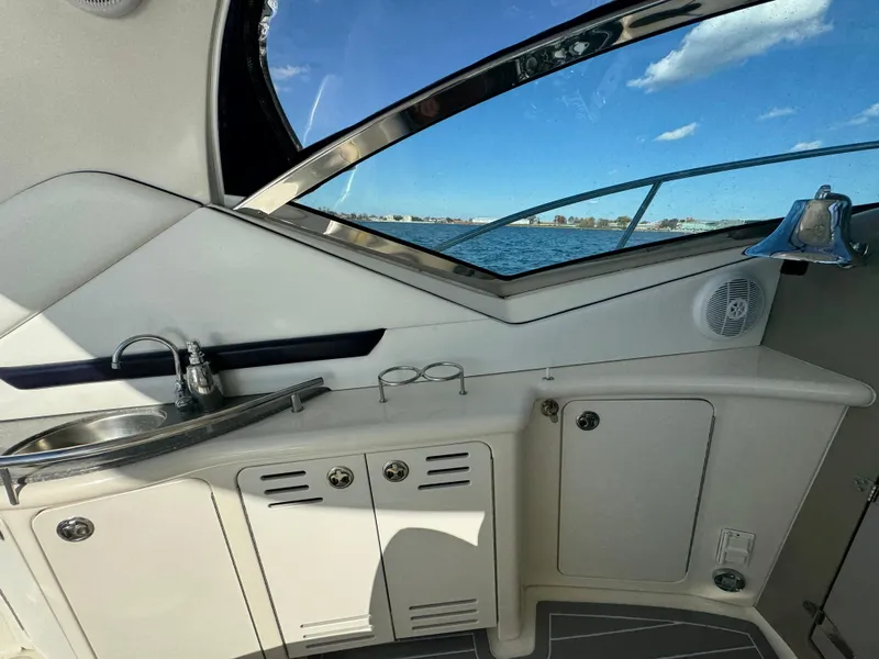 Slide: The Image of Interior of 2007 Sea Ray 440 Sundancer yacht with sink and cabinets, ocean view. - 8