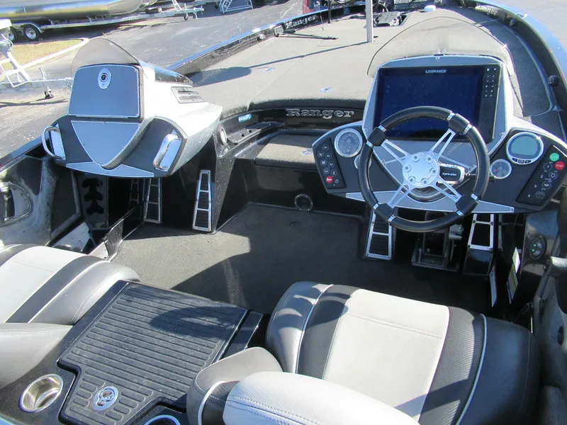 Slide: The Image of 2016 Ranger Z520C boat interior with steering wheel and dashboard controls. - 2