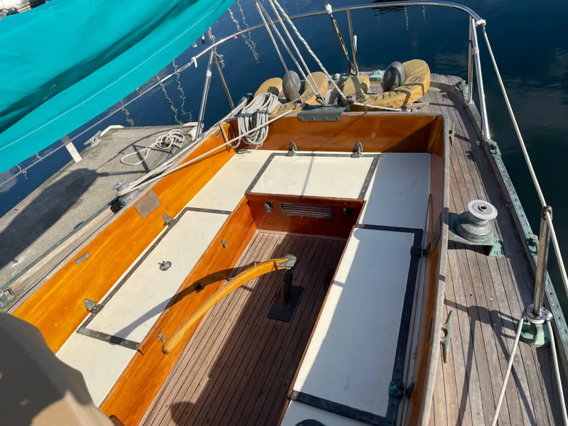 Slide: The Image of 1961 Sparkman & Stephens Pipe Dream Cruising Sloop with wooden deck and teal canopy. - 4