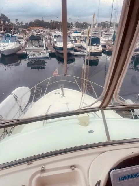 Slide: The Image of 1999 Maxum 4100 SCB yacht docked in a marina, view from the helm. - 7