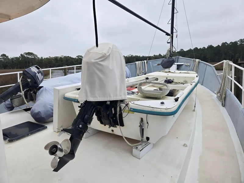 Slide: The Image of Custom 2000 Expedition boat "Cassiopeia" docked on a sunny day. - 10
