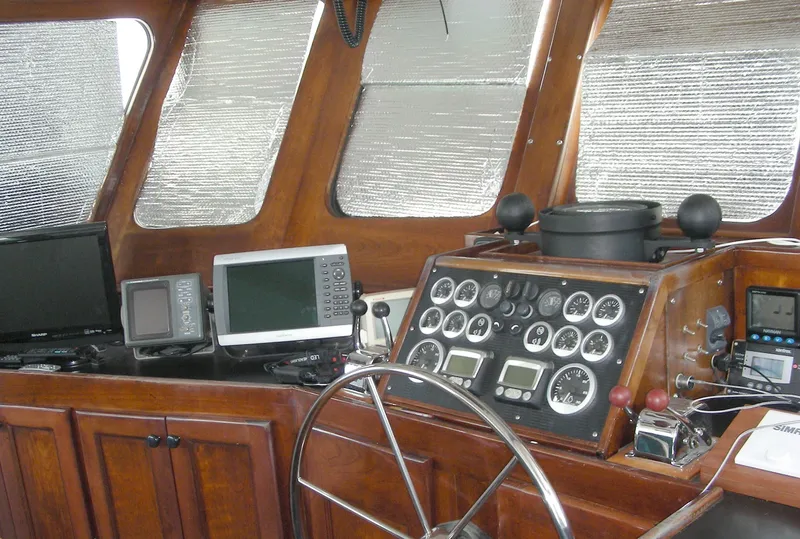 Slide: The Image of Bow of 2000 Expedition custom boat with ropes and anchor on a calm river. - 15