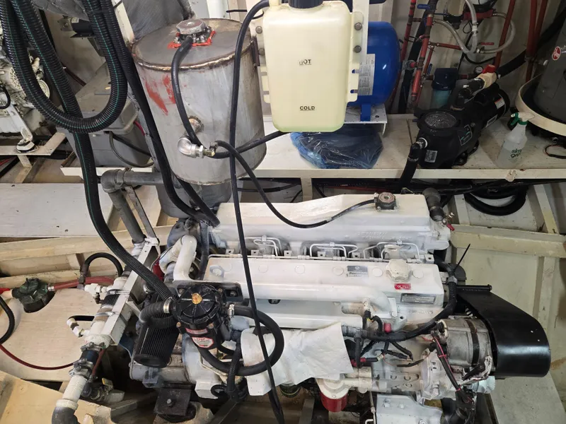 Slide: The Image of Control panel of a 2000 Expedition custom boat with navigation equipment and wooden dashboard. - 16