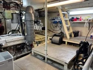 Slide: The Image of Engine room of a 2000 Expedition custom model, showcasing mechanical components and wiring. - 17