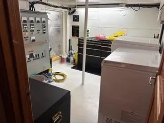 Slide: The Image of Engine room of 2000 Expedition custom model, featuring machinery and safety equipment. - 27