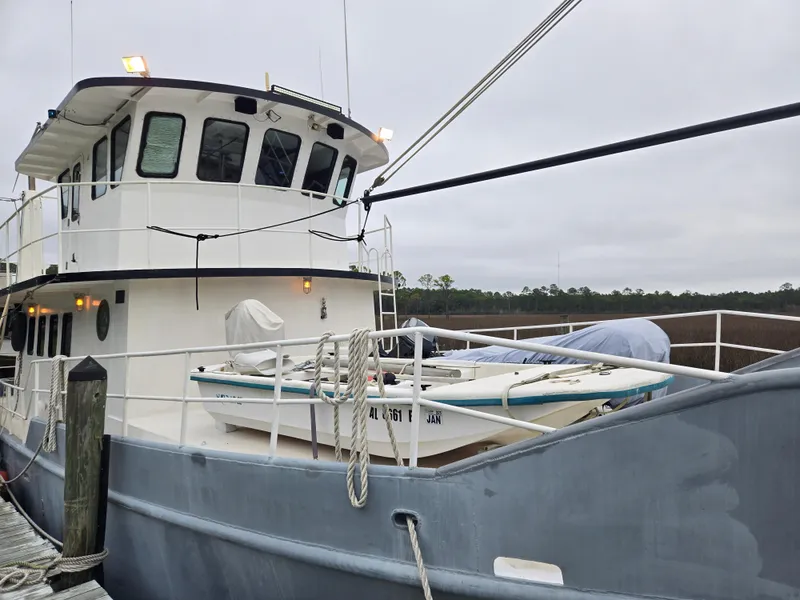 Slide: The Image of Custom Expedition boat from 2000, named Cassiopeia, on dry dock for maintenance. - 3