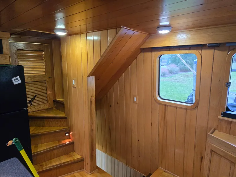 Slide: The Image of Compact kitchen in a 2000 Expedition custom model with wooden cabinets and modern appliances. - 36