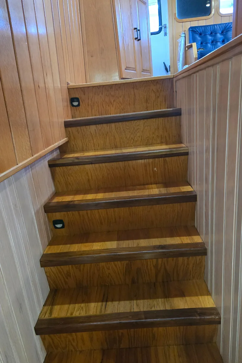 Slide: The Image of Wood-paneled interior of a 2000 Expedition custom model with stairs and window. - 37