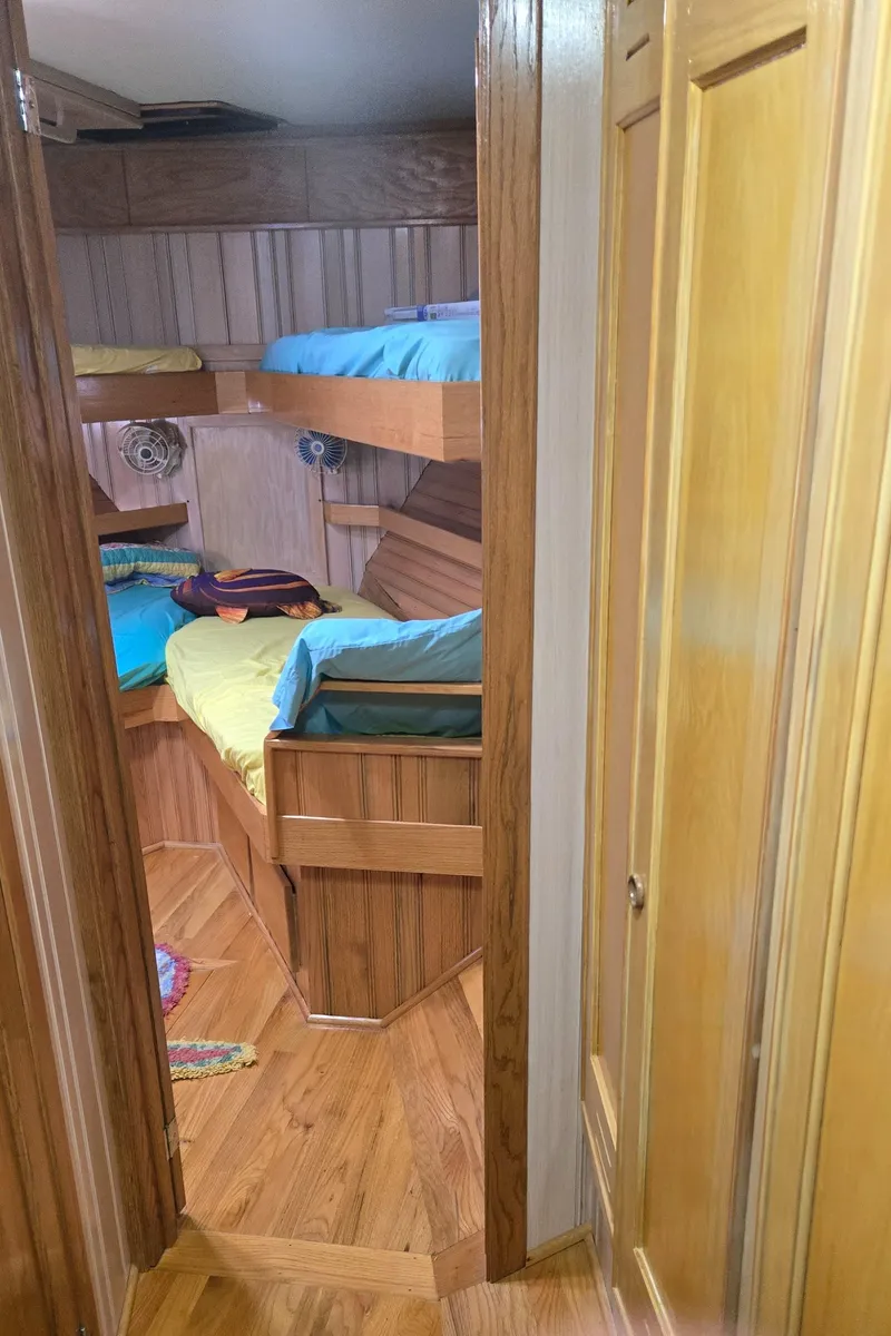 Slide: The Image of Wooden staircase inside 2000 Expedition custom model, featuring warm paneling and built-in lights. - 38