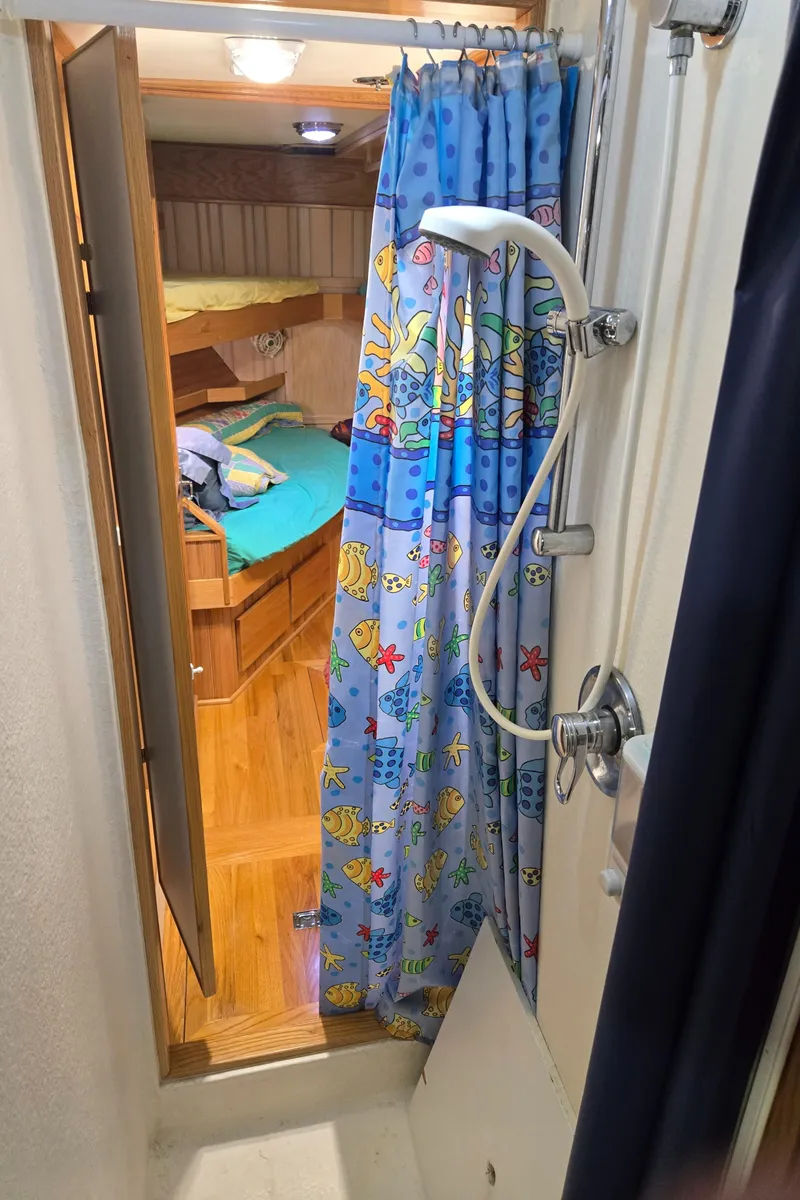 Slide: The Image of Cozy wooden bunk beds with colorful bedding in a 2000 Expedition custom model. - 40