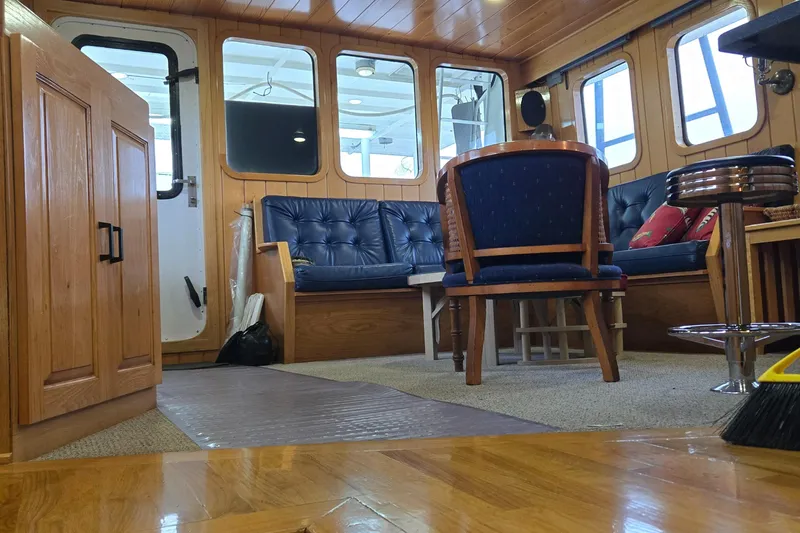 Slide: The Image of Compact shower area in 2000 Expedition custom vehicle with colorful curtain and cozy interior. - 41