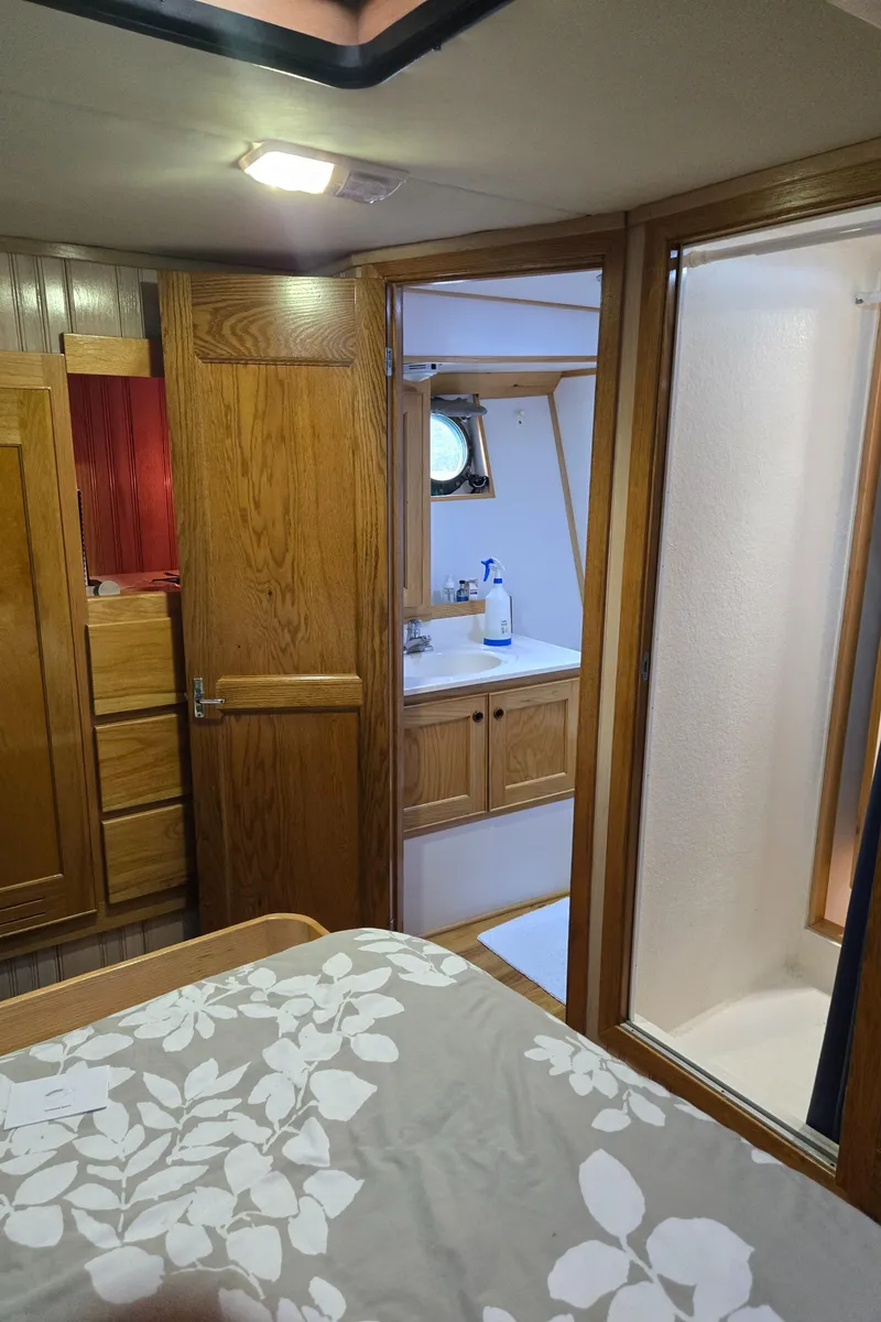 Slide: The Image of Cozy bed with floral bedding in a 2000 Expedition custom model interior. - 44