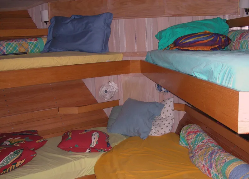 Slide: The Image of Compact bathroom with wooden cabinets, white sink, and toilet in a 2000 Expedition custom model. - 46