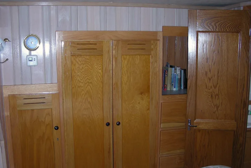 Slide: The Image of Cozy cabin interior with colorful bedding in a 2000 Expedition custom model. - 47