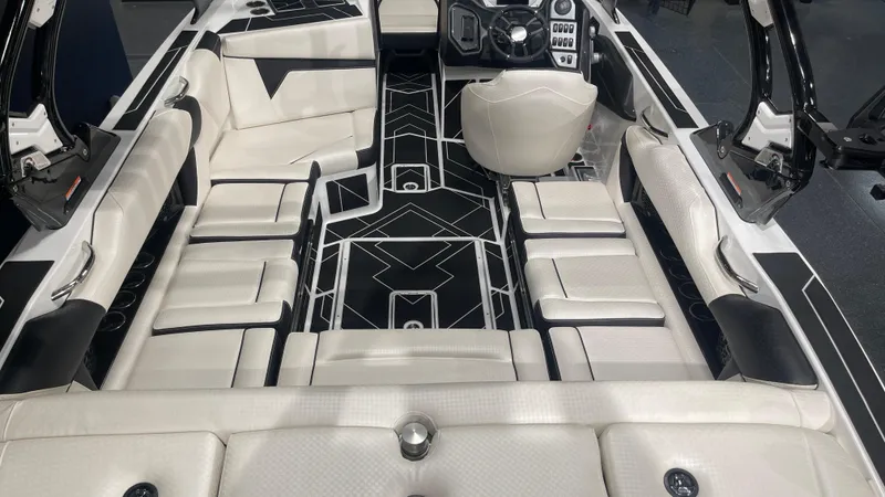 Slide: The Image of 2024 Supreme S220 boat interior with luxurious seating and modern dashboard design. - 10