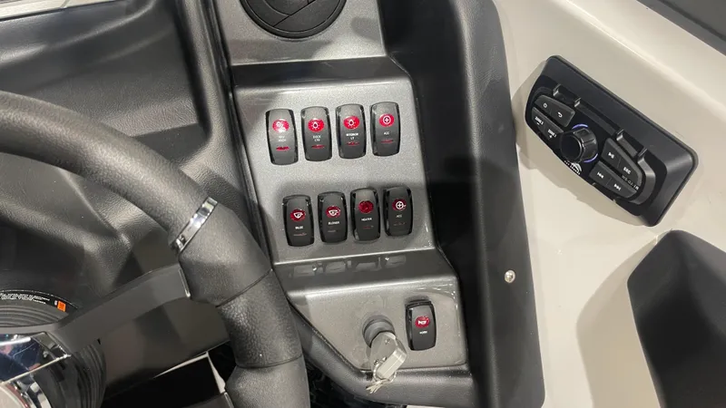 Slide: The Image of 2024 Supreme S220 dashboard with control switches and steering wheel. - 13