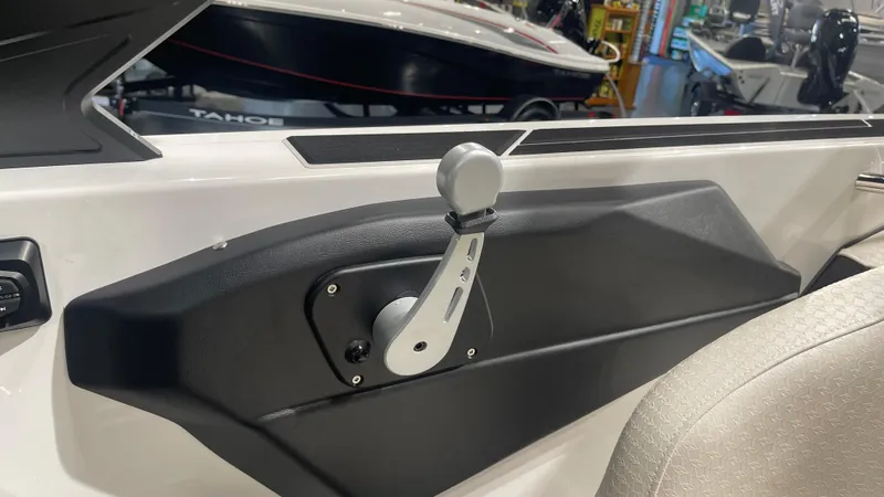 Slide: The Image of 2024 Supreme S220 boat throttle control in a showroom setting. - 15