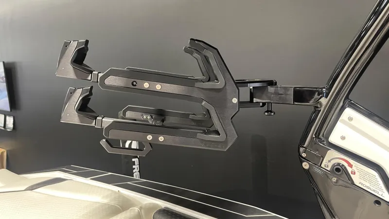 Slide: The Image of 2024 Supreme S220 boat accessory, black metal rack on sleek interior. - 20