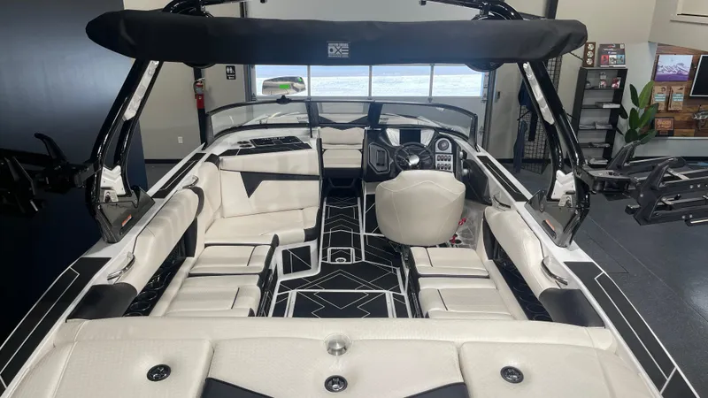 Slide: The Image of 2024 Supreme S220 boat interior with modern seating and sleek design. - 9