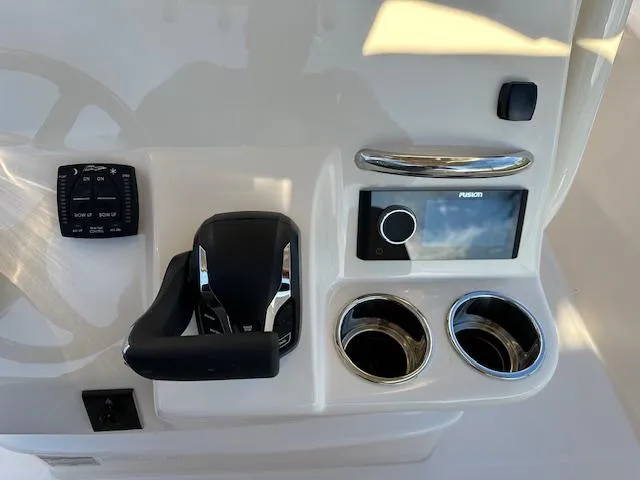 Slide: The Image of Control panel of 2025 Grady-White 231 Coastal Explorer boat with modern features. - 11