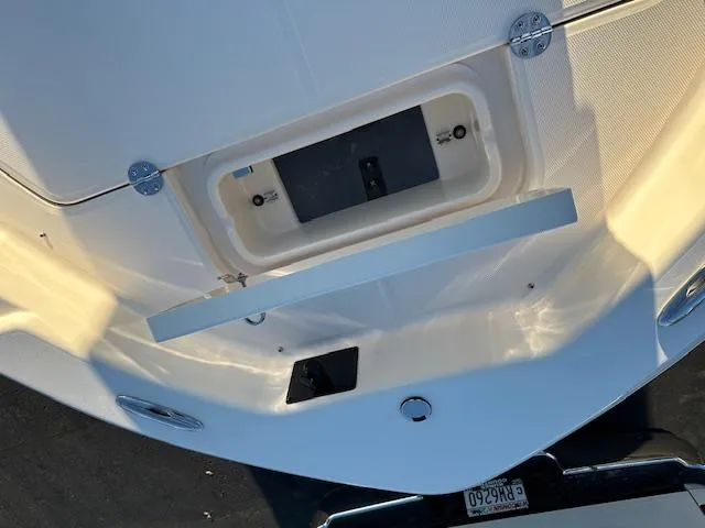 Slide: The Image of 2025 Grady-White 231 Coastal Explorer boat, detailed view of the deck and storage compartment. - 23