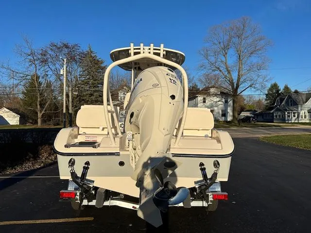 Slide: The Image of 2025 Grady-White 231 Coastal Explorer boat, rear view, parked on trailer. - 3
