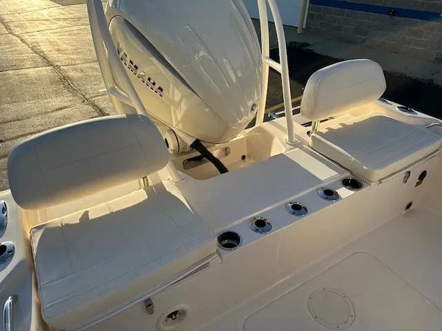 Slide: The Image of 2025 Grady-White 231 Coastal Explorer boat seating and engine detail. - 32