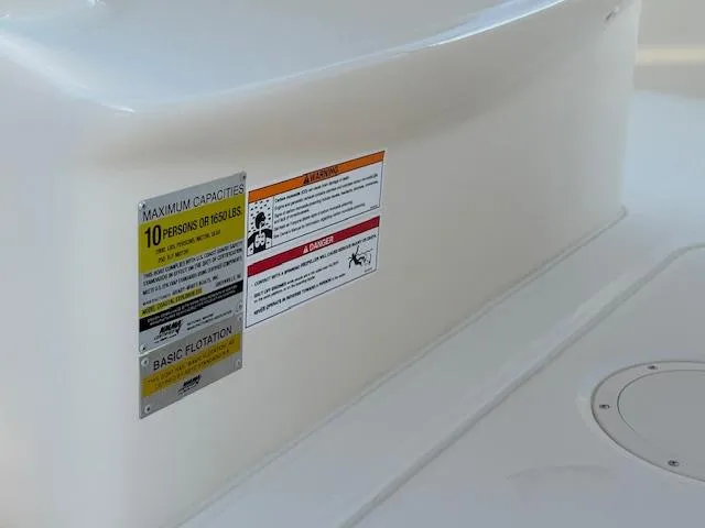 Slide: The Image of Capacity label on 2025 Grady-White 231 Coastal Explorer boat, indicating 10-person limit. - 33