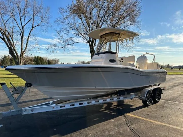 Slide: The Image of 2025 Grady-White 231 Coastal Explorer boat on trailer, parked outdoors. - 7