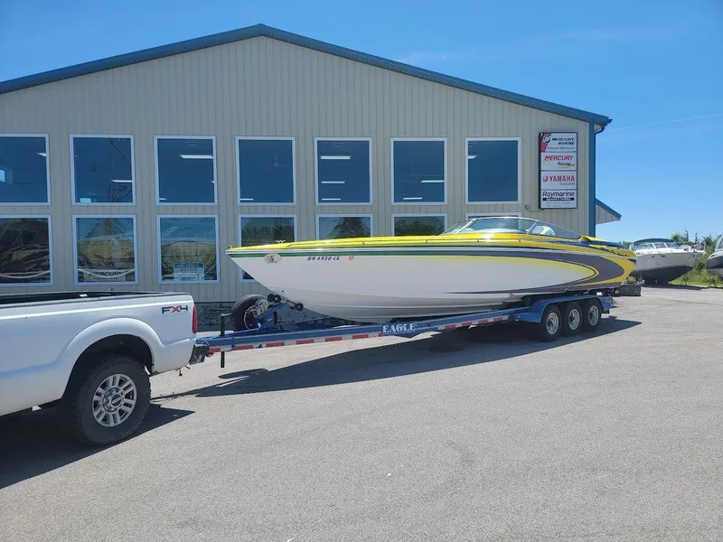 The Image of 1998 Formula 353 FASTech boat on trailer outside a building. - 0