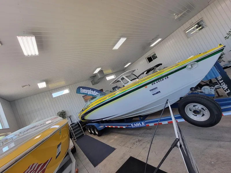 Slide: The Image of 1998 Formula 353 FASTech boat on trailer in indoor showroom. - 11