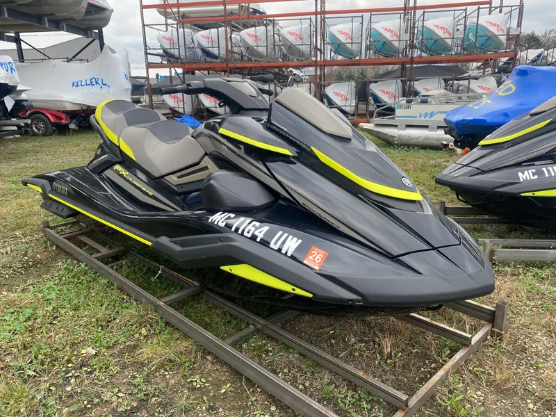 Slide: The Image of 2023 Yamaha WaveRunner FX Cruiser SVHO in black and yellow on display outdoors. - 3