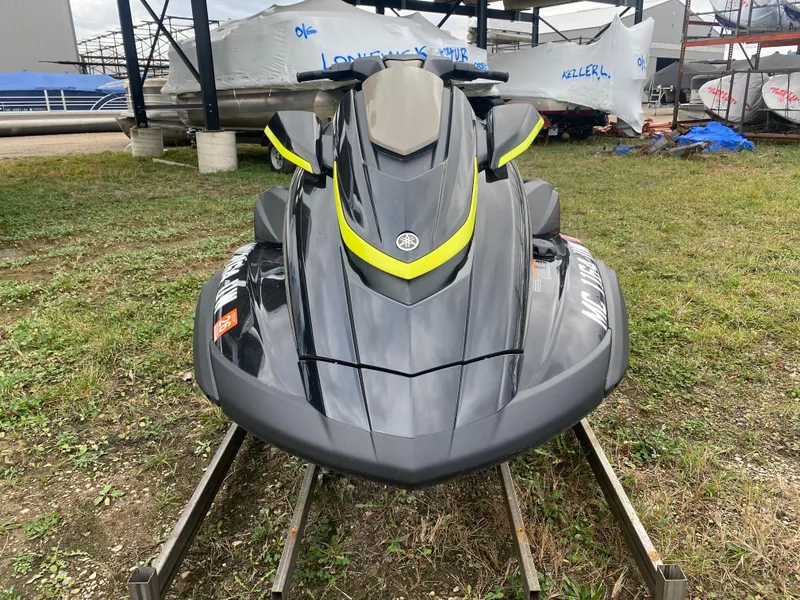 Slide: The Image of 2023 Yamaha WaveRunner FX Cruiser SVHO on display, sleek design, parked on grass. - 4