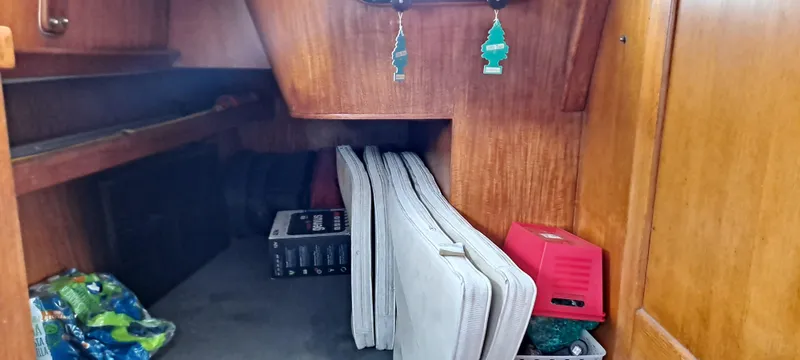 Slide: The Image of Interior cabin of 1985 Cheoy Lee Pedrick 38w sailboat with cushions and storage. - 6
