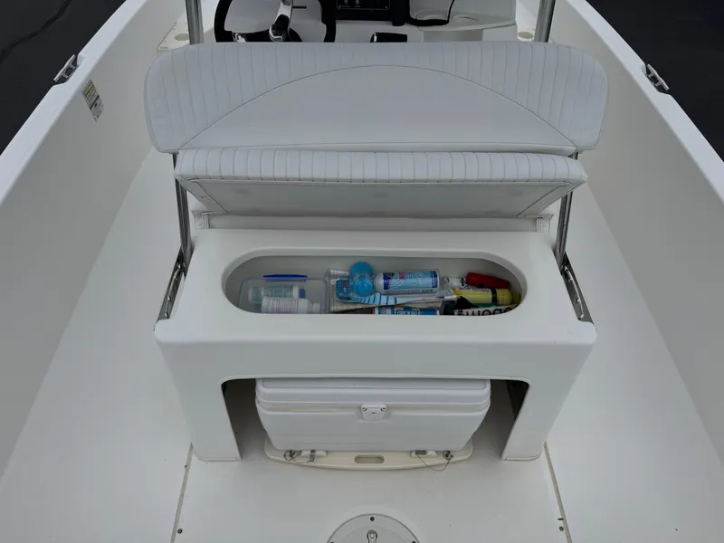 Slide: The Image of 2008 Boston Whaler 200 Dauntless boat interior with storage compartment and cooler. - 13