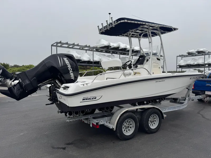 Slide: The Image of 2008 Boston Whaler 200 Dauntless boat on trailer with Mercury outboard motor. - 4