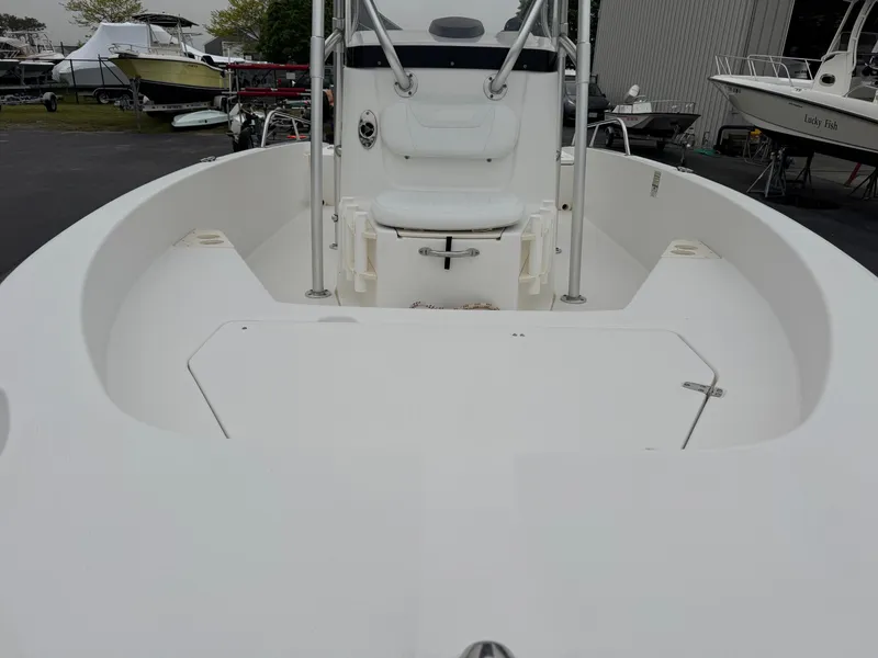 Slide: The Image of 2008 Boston Whaler 200 Dauntless boat interior, featuring spacious seating and sleek design. - 5
