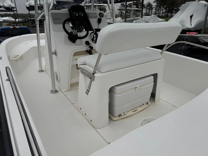 Slide: The Image of 2008 Boston Whaler 200 Dauntless boat interior with helm and seating area. - 6