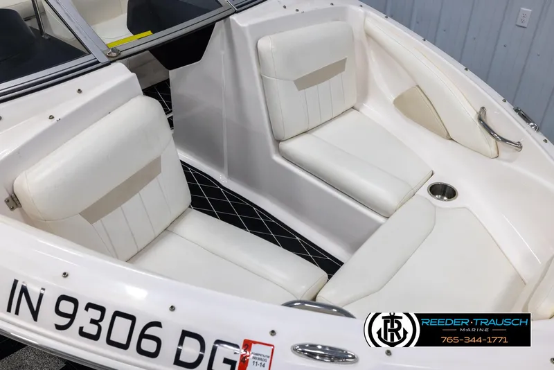 Slide: The Image of 2008 Regal 1900 boat interior with white seating and registration number IN 9306 DG. - 10