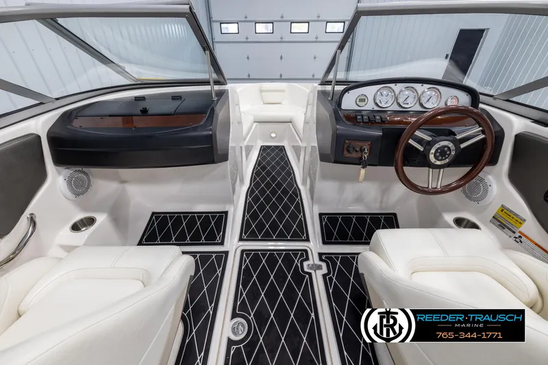 Slide: The Image of 2008 Regal 1900 boat interior with sleek dashboard and comfortable seating. - 16
