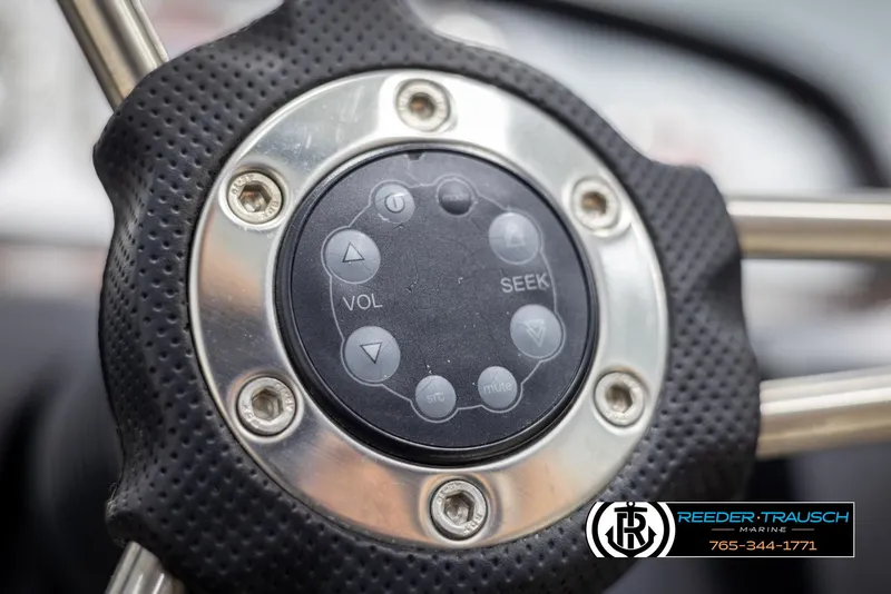 Slide: The Image of Close-up of a 2008 Regal 1900 steering wheel with control buttons. - 28