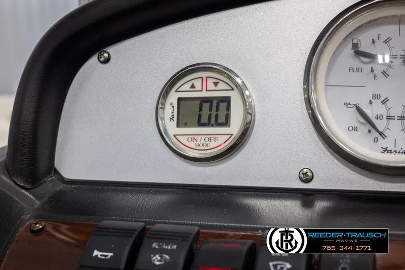 Slide: The Image of Dashboard of a 2008 Regal 1900 boat with digital and analog gauges. - 30